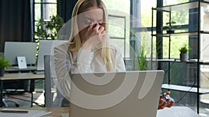 Tired exhausted Caucasian businesswoman in office girl woman suffer eyestrain overworked fatigued with laptop business