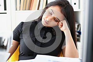 Tired and exhausted woman have a lot of work with documents fall asleep