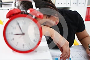 Tired and exhausted woman have a lot of work with documents fall asleep