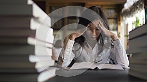 Tired female asian sudent lawyer in white shirt trying