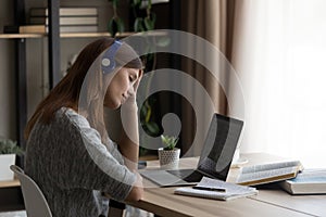 Tired female student overwhelmed with computer work