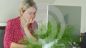 tired frustrated adult female businesswoman student looking at computer at home