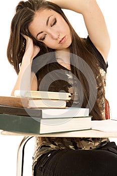 Tired girl student eyes closed hands in her hair