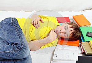 Tired Kid sleep on the Books