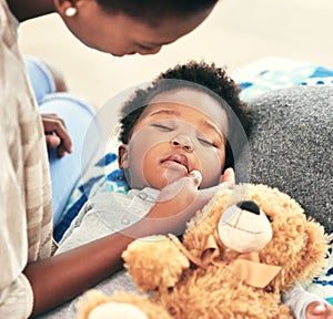 Tired, kid and sleeping with teddy bear on bed for child development, comfortable and peace. Black family, baby and hand