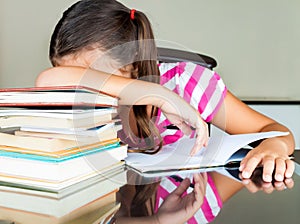 Tired latin schoolgirl sleeping on her desk