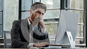 Tired lazy napping yawn adult bearded man male manager worker bored at work project online in computer in office