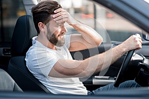 Tired man driving a car