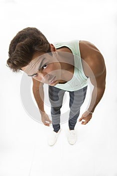 Tired man looking with curiosity from the top isolated on white