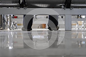 Tired man waiting on station chairs