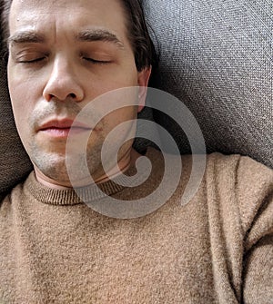 Tired Man Sleeping on Couch - Careworn Face