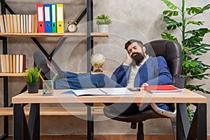 Tired manager napping with legs on desk during work rest in office, nap