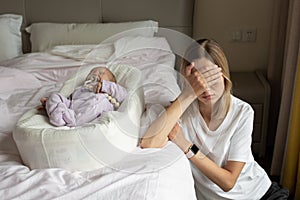 Tired Mother Suffering from experiencing postnatal depression. Health care mom motherhood stressful. Stay at home during