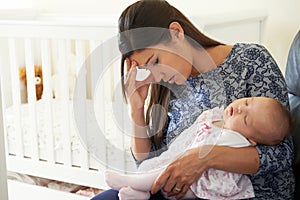 Tired Mother Suffering From Post Natal Depression