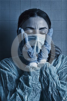 Tired nurse with the protective mask