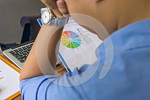 Tired office man reading financial report document