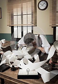 Tired overworked accountant in office, 1950s style