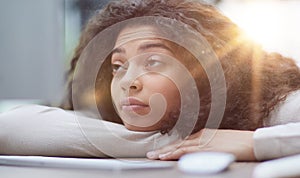 Tired overworked woman resting at workplace in office