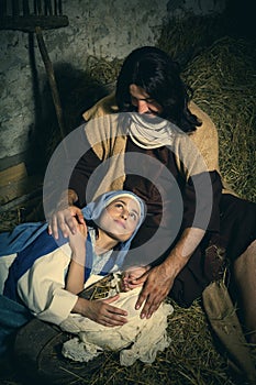 Tired parents in christmas nativity scene