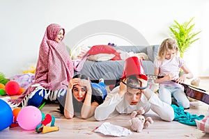 Tired parents and romping kids