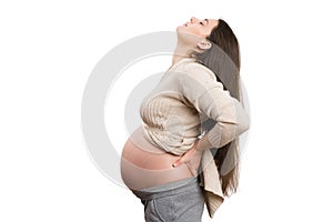 Tired pregnant woman feeling back pain