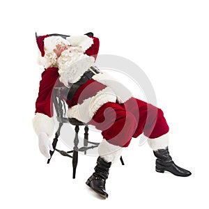 Tired Santa Claus Sitting On Chair photo