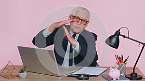Tired serious upset senior businessman showing time out gesture, limit or stop sign, no pressure