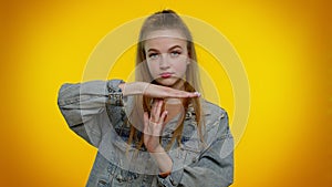 Tired serious teen girl showing time out gesture, limit or stop sign, no pressure, i need more time