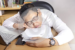 Tired Sleepy Asian Businessman Having Overworked