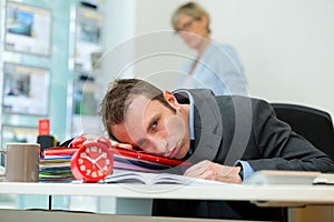 tired and sleepy business man at workplace