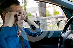Tired Sleepy Man Or Driver Driving Car And Yawning