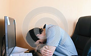 Tired sleepy man sleep at computer.