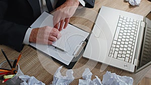 Tired sleepy overworked senior business man falling asleep sit at home office desk with laptop