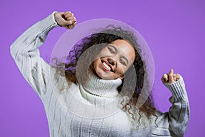 Tired sleepy woman yawns. Girl stretches hands up. Very boring, uninteresting. Violet studio background.