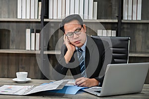 Tired stressed  business man suffering from neckpain working in office sitting at table