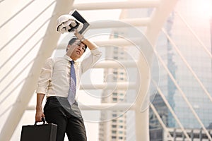 Tired or stressful businessman stop walking in city after working