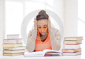 Tired student with books and notes
