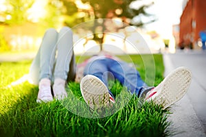 Tired students enjoy the rest in the yard of the University campus