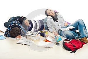 Tired students sleeping on floor