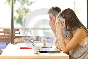 Tired students studying in a coffee shop