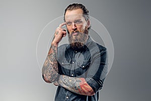 Tired man with beard and tattooes