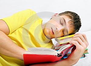 Tired Teenager sleep on the Books