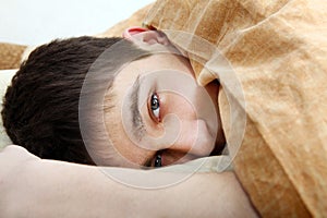 Tired Teenager Under Blanket