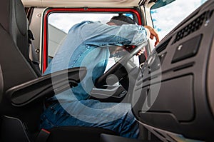 Tired Truck Driver Sleeping on Steering Wheel