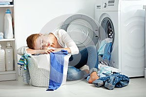 Tired unhappy woman housewife is engaged in the laundry,