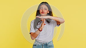 Tired upset Indian woman showing pause gesture limit or stop sign, time out, take a break relax rest