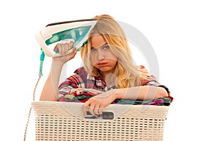 Tired woman with a basket of loundry annoyed with too much work