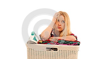 Tired woman with a basket of loundry annoyed with too much work