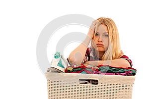 Tired woman with a basket of loundry annoyed with too much work