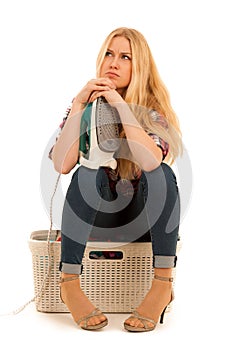 Tired woman with a basket of loundry annoyed with too much work